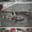 Before and after photos showing a vintage music instrument repaired, cleaned, and polished.