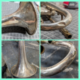 A dented cornet (trumpet) that has been repaired